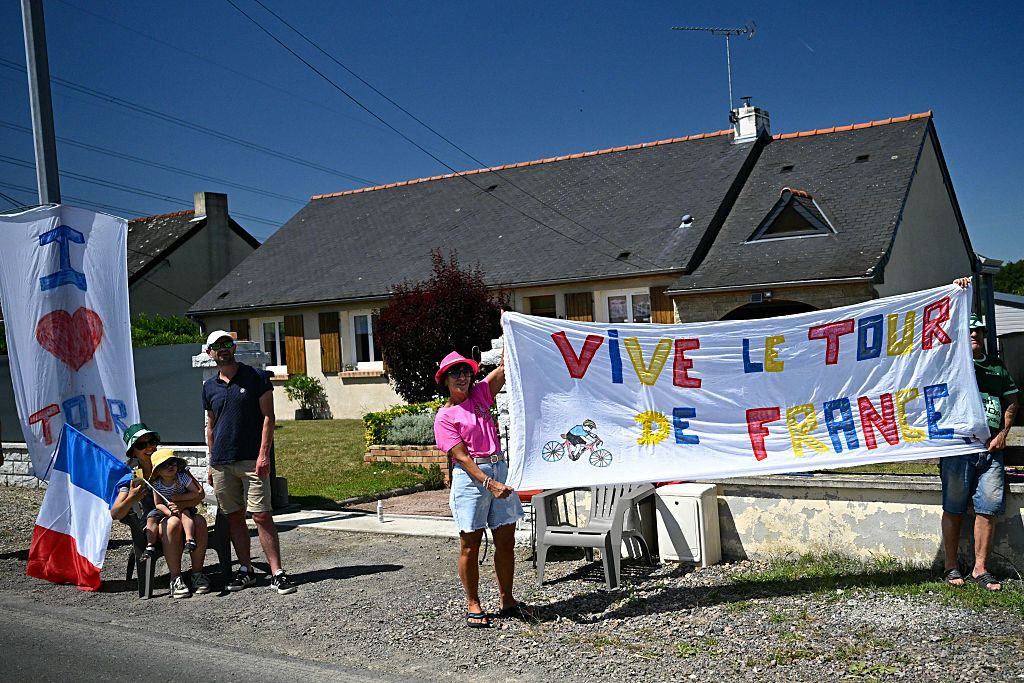 Spectators cheer along the race route during the 6th stage of the 112th edition of the Tour de France cycling race, 201.5 km between Bayeux and Vire Normandie, Northwestern France, on July 10, 2025. (Photo by Loic VENANCE / AFP) (Photo by LOIC VENANCE/AFP via Getty Images)