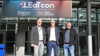 Company leaders gather smiling as LEA Professional Amplifies European Presence Through Partnership with German Distributor.