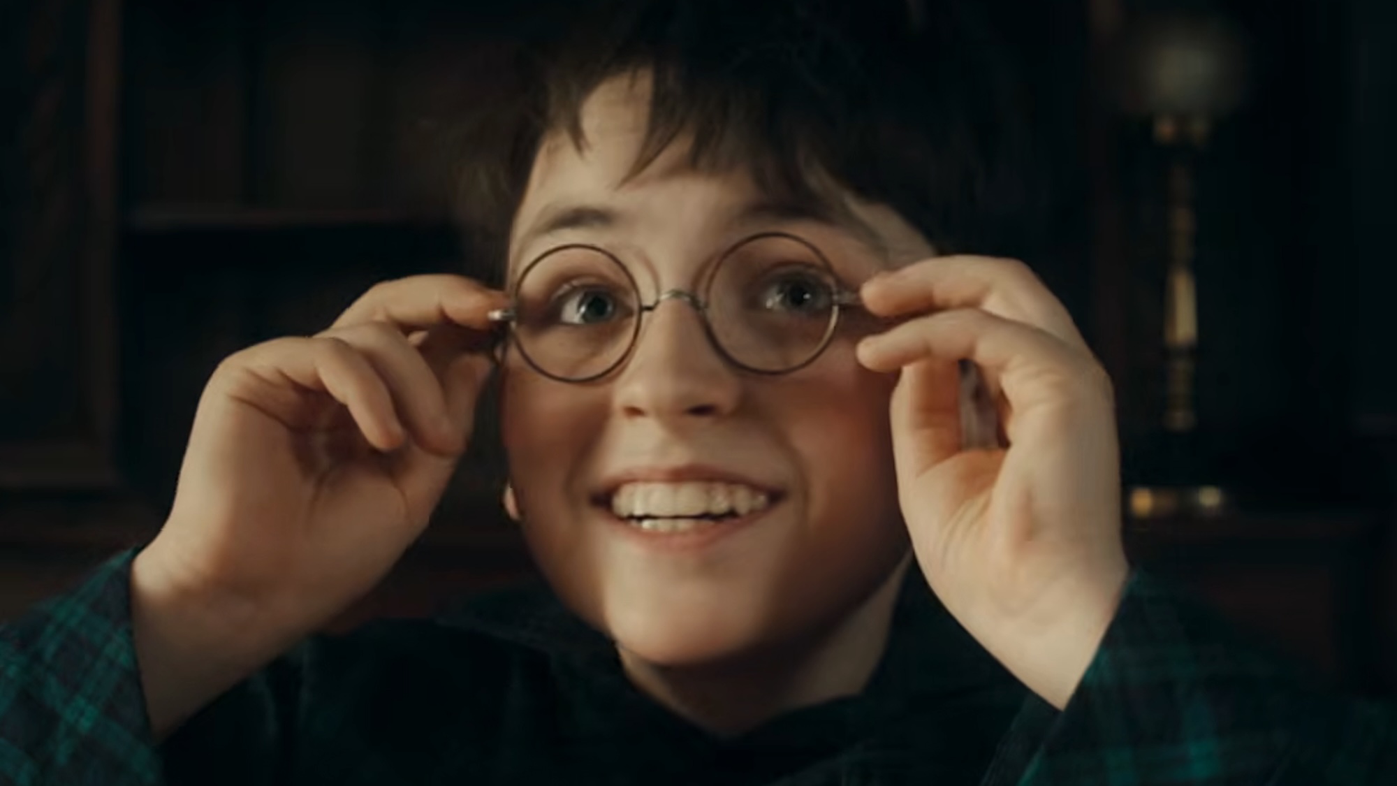 Dominic McLaughlin smiling as Harry Potter in the new TV show