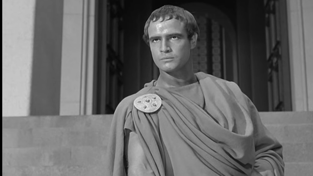 Marlon Brando in a Roman togo looking serious in William Shakespeare's Julius Caesar