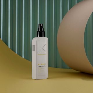 kevin murphy blow dry hair product in white container against green background
