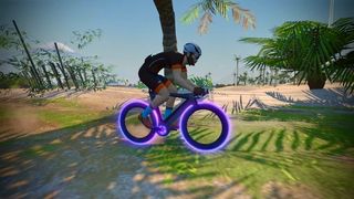 A rider in Zwift on a Tron bike