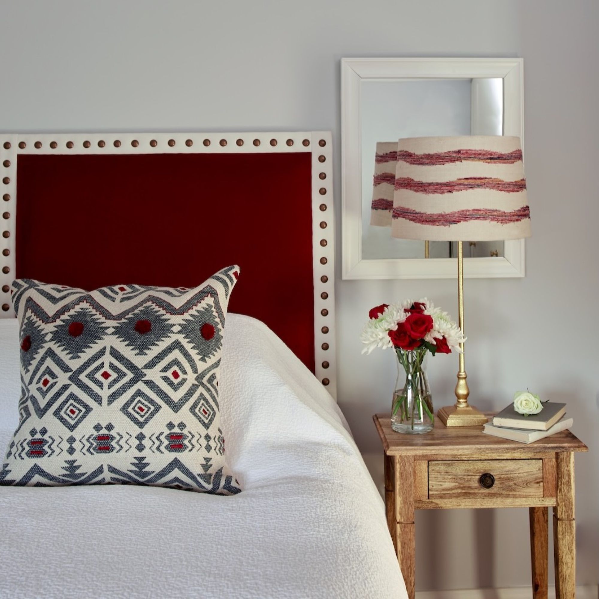bedroom with bedside table and pretty lamp