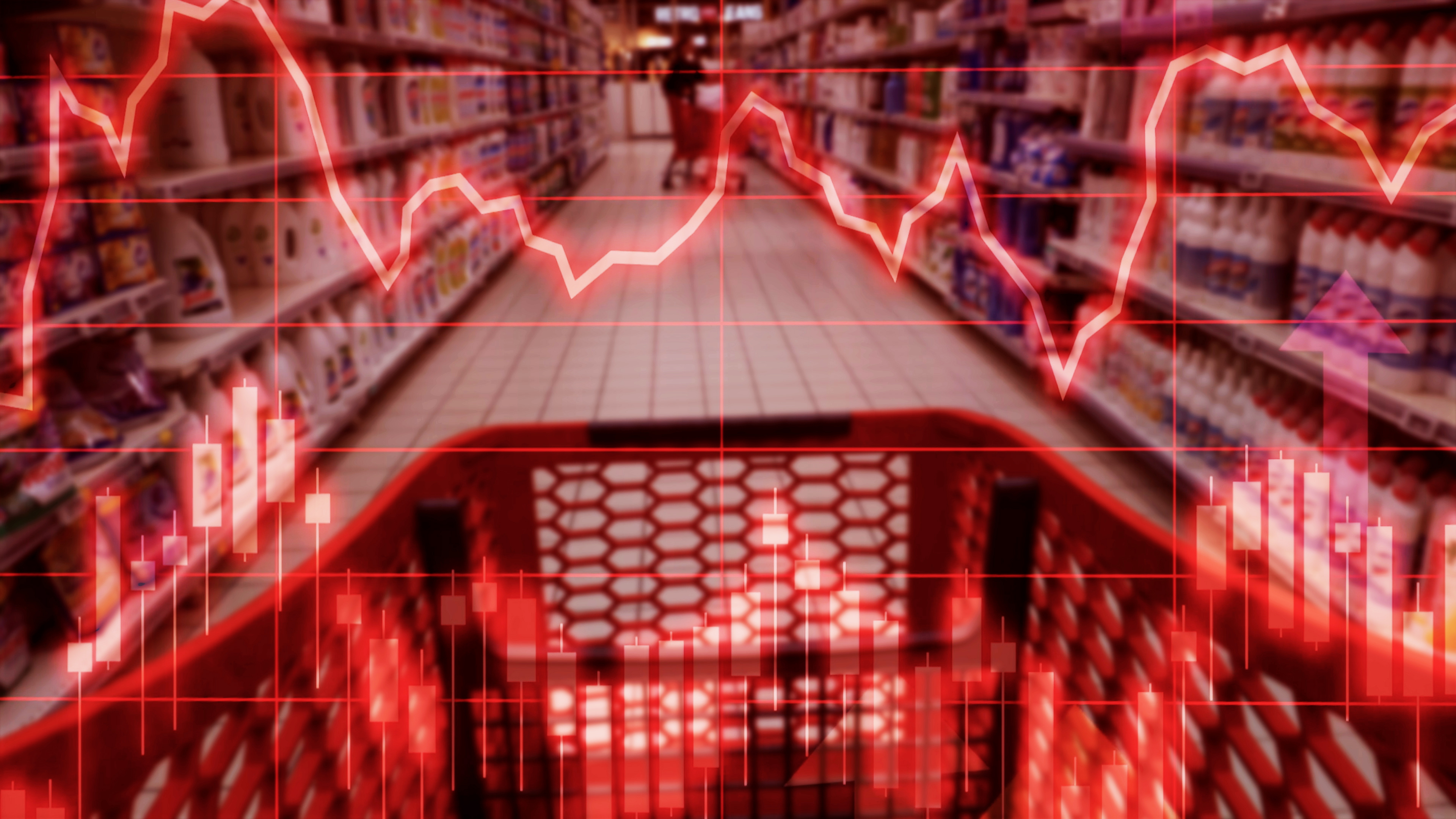 Shopping trolley in supermarket with financial chart superimposed. Image is tinted red.