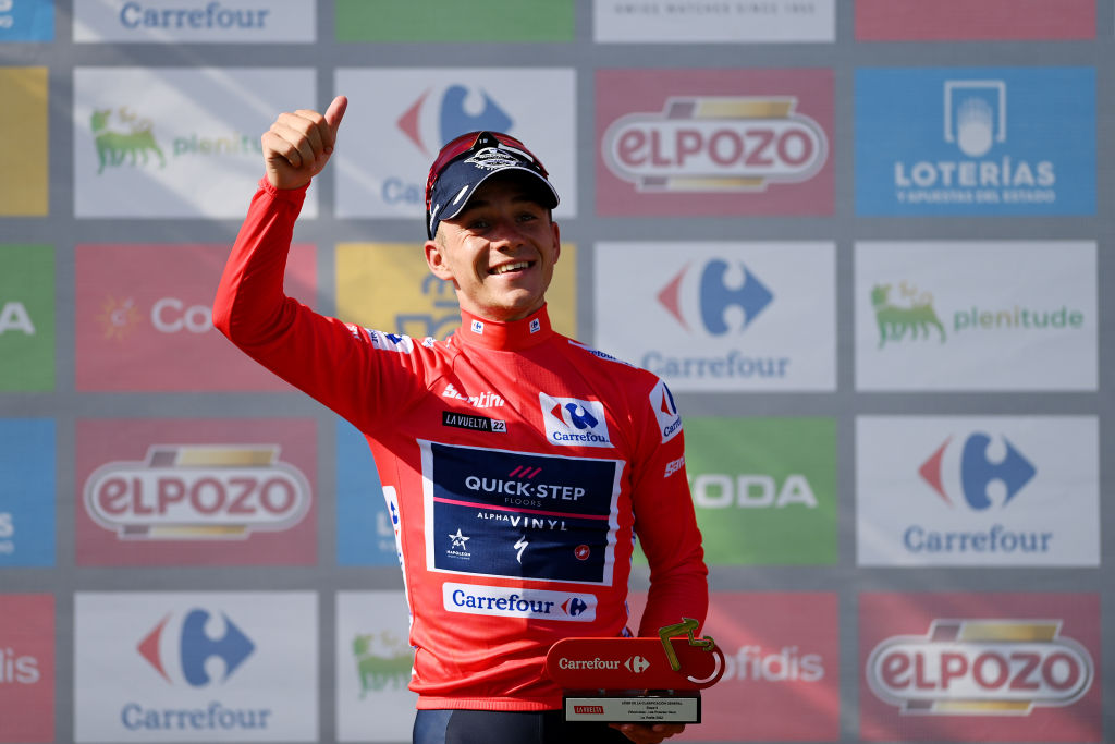 LES PRAERESNAVA SPAIN AUGUST 28 Remco Evenepoel of Belgium and Team QuickStep Alpha Vinyl Red Leader Jersey celebrates at podium during the 77th Tour of Spain 2022 Stage 9 a 1714km stage from Villaviciosa to Les Praeres Nava 743m LaVuelta22 WorldTour on August 28 2022 in Les Praeres Nava Spain Photo by Justin SetterfieldGetty Images