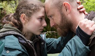 Leave No Trace Thomasin McKenzie Ben Foster heads together in the woods