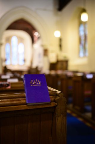 Viltrox AF 35mm F1.2 LAB lens sample gallery: a bible sits on a pew in an old church