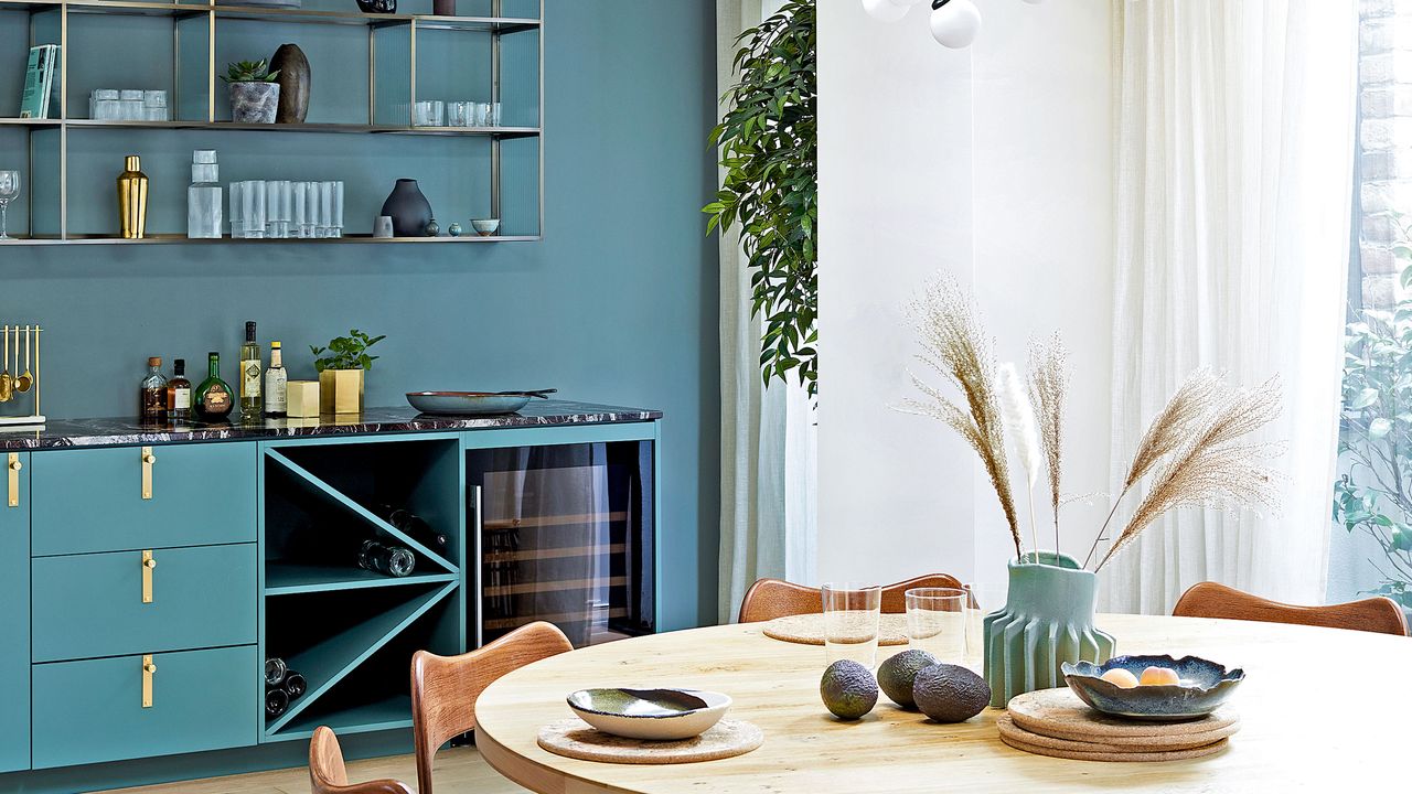 blue kitchen with round dining table