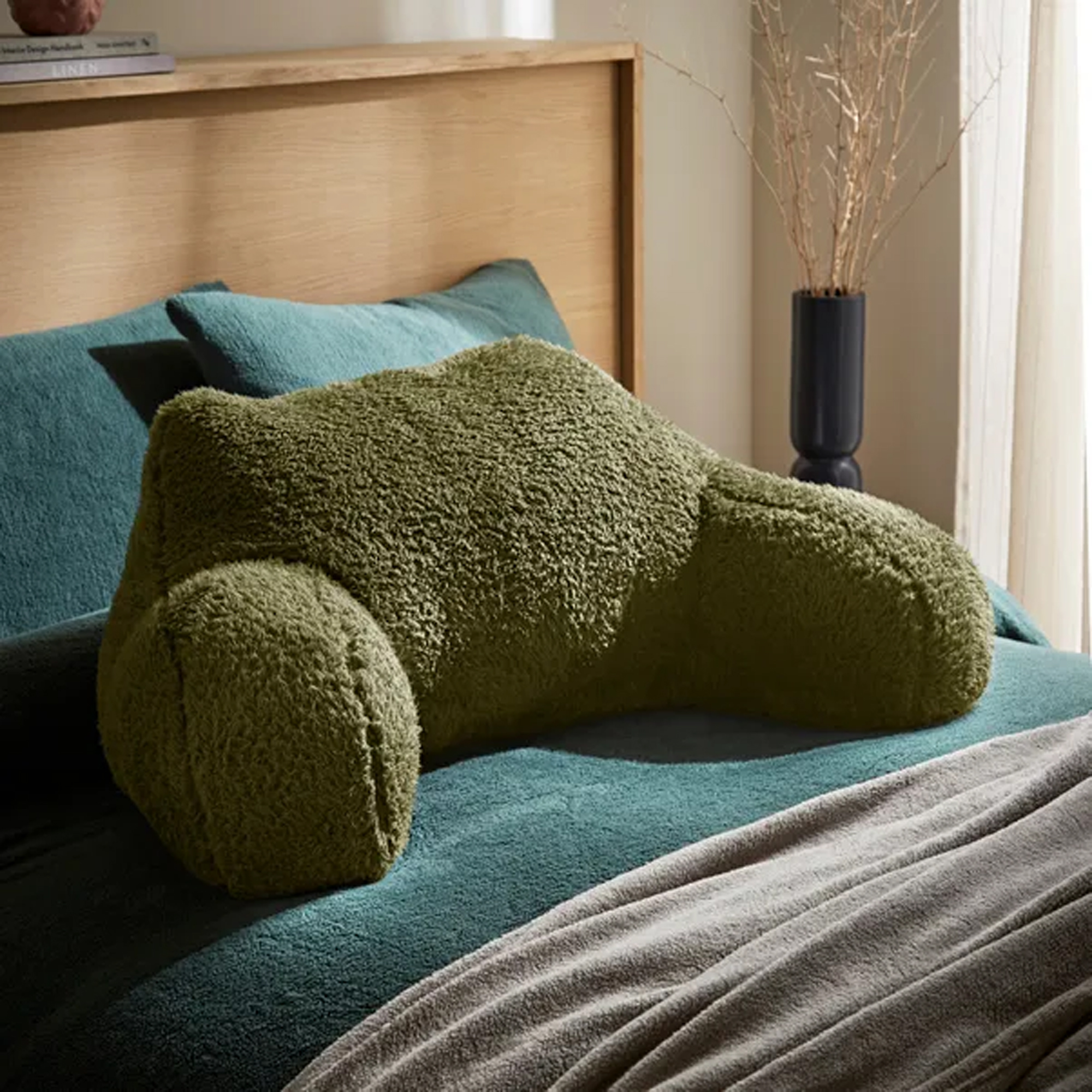 Dunelm Teddy Bear cuddle cushion in olive