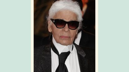 Fashion designer Karl Lagerfield arrives for the annual Rose Ball at the Monte-Carlo Sporting Club in Monaco, on March 19, 2016. / on a green background