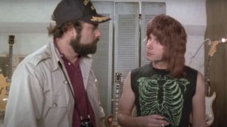 Rob Reiner and Christopher Guest talking in a studio room in This Is Spinal Tap