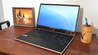 Asus Chromebook Flip CX5 (2022) on desk with righthand side facing camera