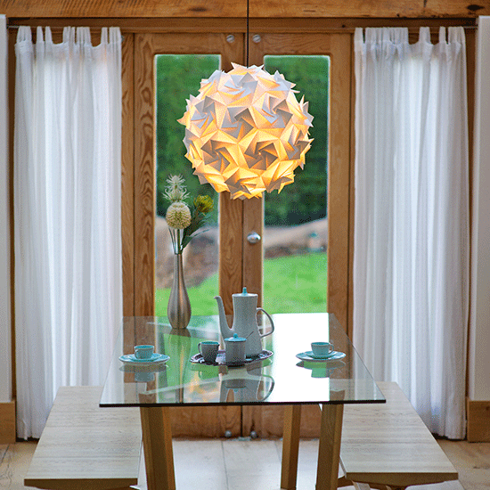 aperture pendant light with glass table with bench