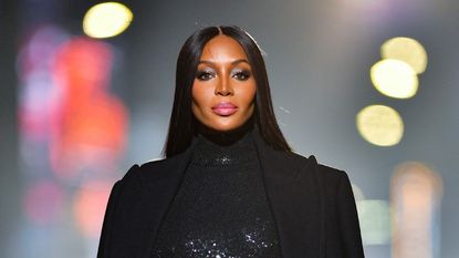 Naomi Campbell walks along 46th Street during the Michael Kors Fashion Show in Times Square on April 08, 2021 in New York City.