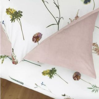 white designed and pink pillow