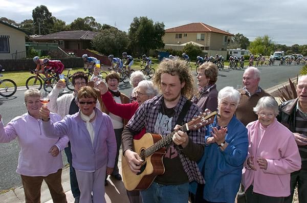 Members of the Numurkah Senior Citizens Club are entertained as the peloton speed by.