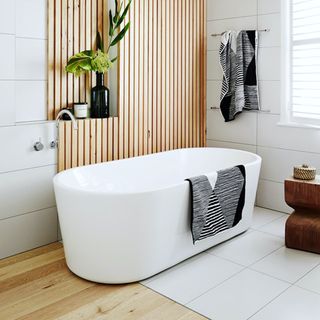 bathroom with wooden panel and glass vase
