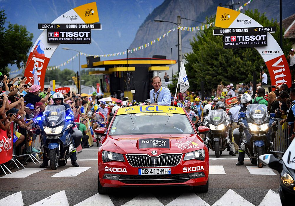 The start of stage 13 at the Tour de France, director Christian Prudhomme, in the lead vehicle