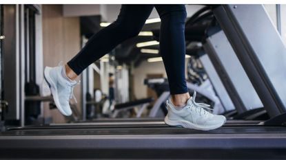 Woman's legs running Couch to 5km on a treadmill at the gym