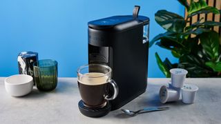 the keurig k-mini mate coffee maker photographed with the blue tom's guide background