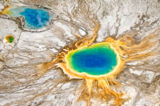 Photograph of the Grand Prismatic Spring and Excelsior Geyser Crater in the Midway Geyser Basin of Yellowstone National Park, taken by Charles Glatzer