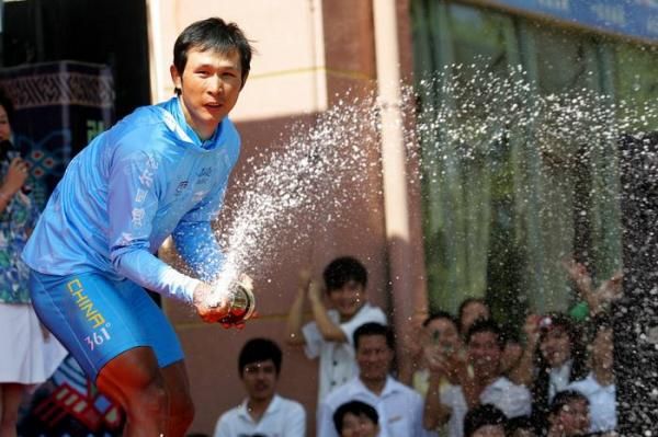 Ma Haijun (China) lets loose with the champagne.