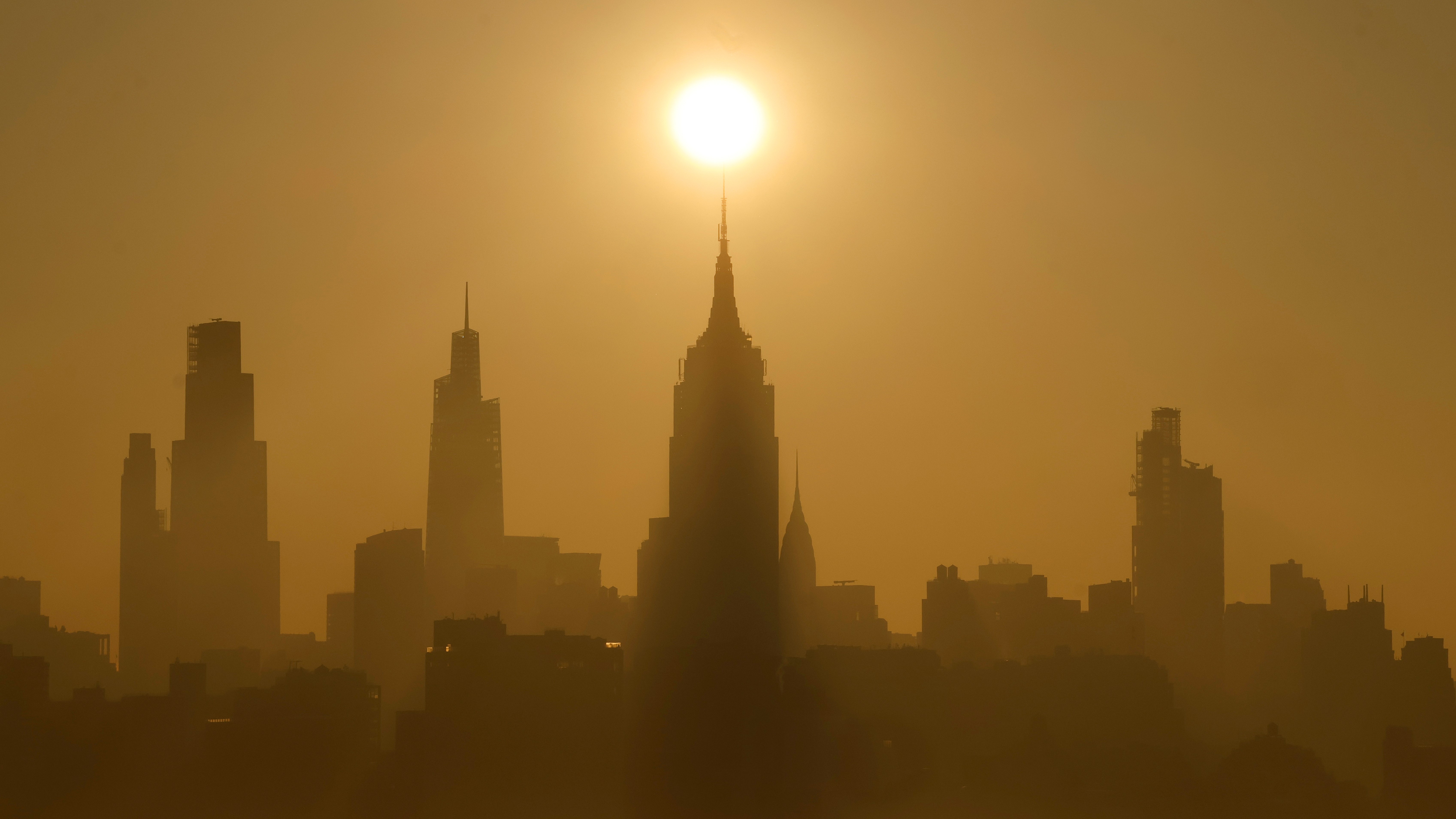 A photograph of the New York City skyline at sunrise before a major heat wave.