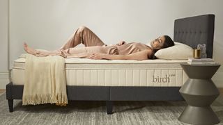 Birch Luxe Natural mattress with a person lying on their back