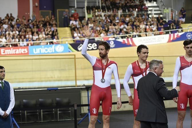 Men's team pursuit silver medal winners from England: Bradley Wiggins waves to the crowd from the podium