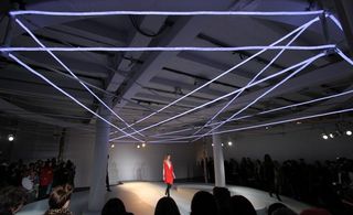 Large catwalk space with neon lights