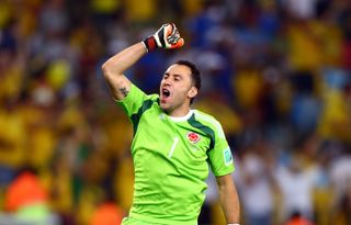 Colombia goalkeeper David Ospina celebrates a goal against Uruguay at the 2014 World Cup.