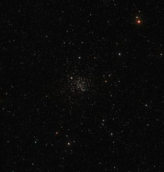 The Messier 67 star cluster shines in the center of this image. The star cluster plays host to about 500 stars that are all around the same age and composition as the sun. Image released Jan. 15, 2014.