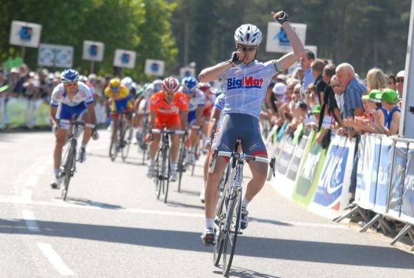 Race winner Sylvain Georges salutes as he crosses the finish line