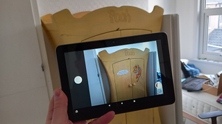 Amazon Fire tablet being used to photograph Disney furniture