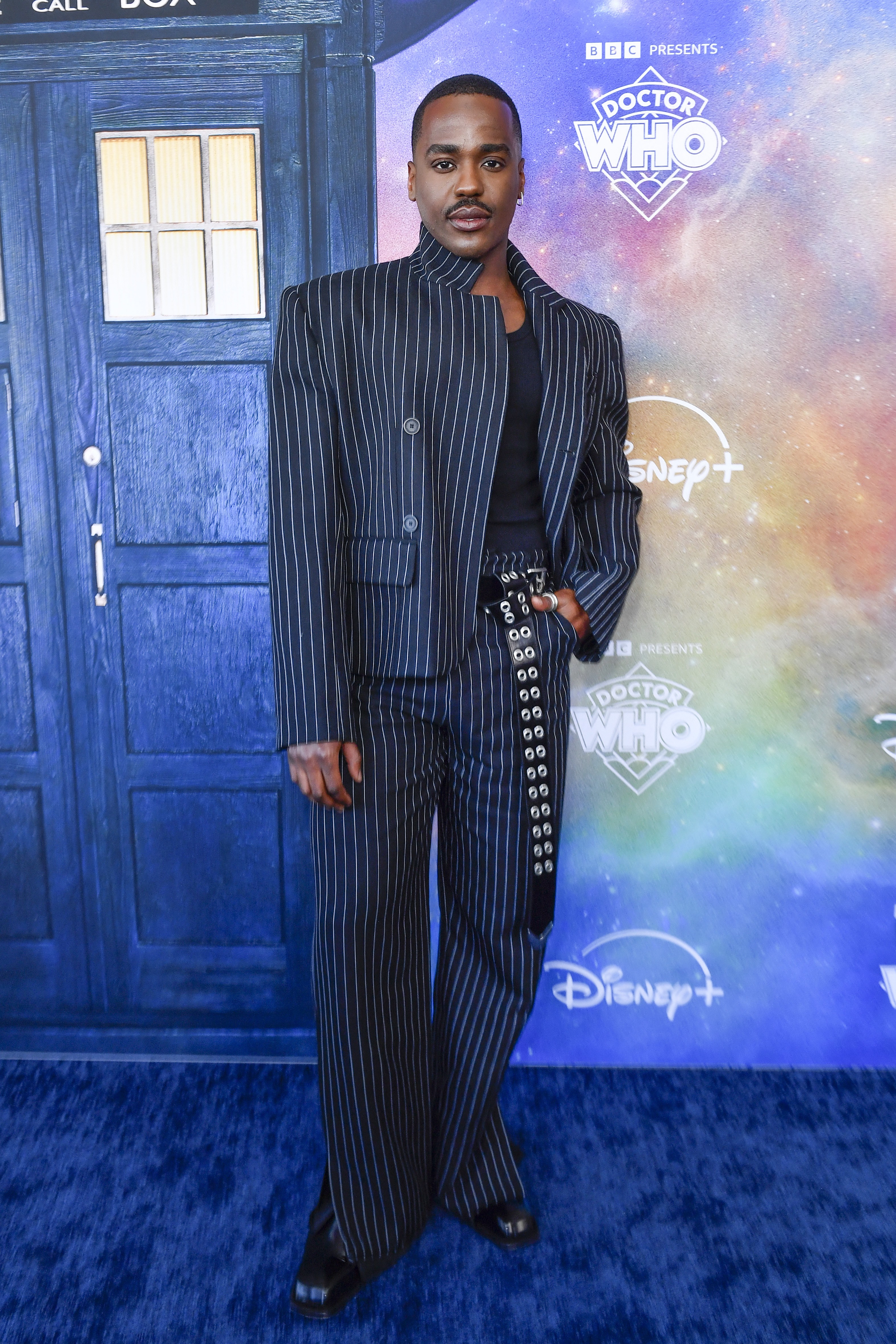 Ncuti Gatwa wears a pinstripe suit at the premiere of the new season of 
