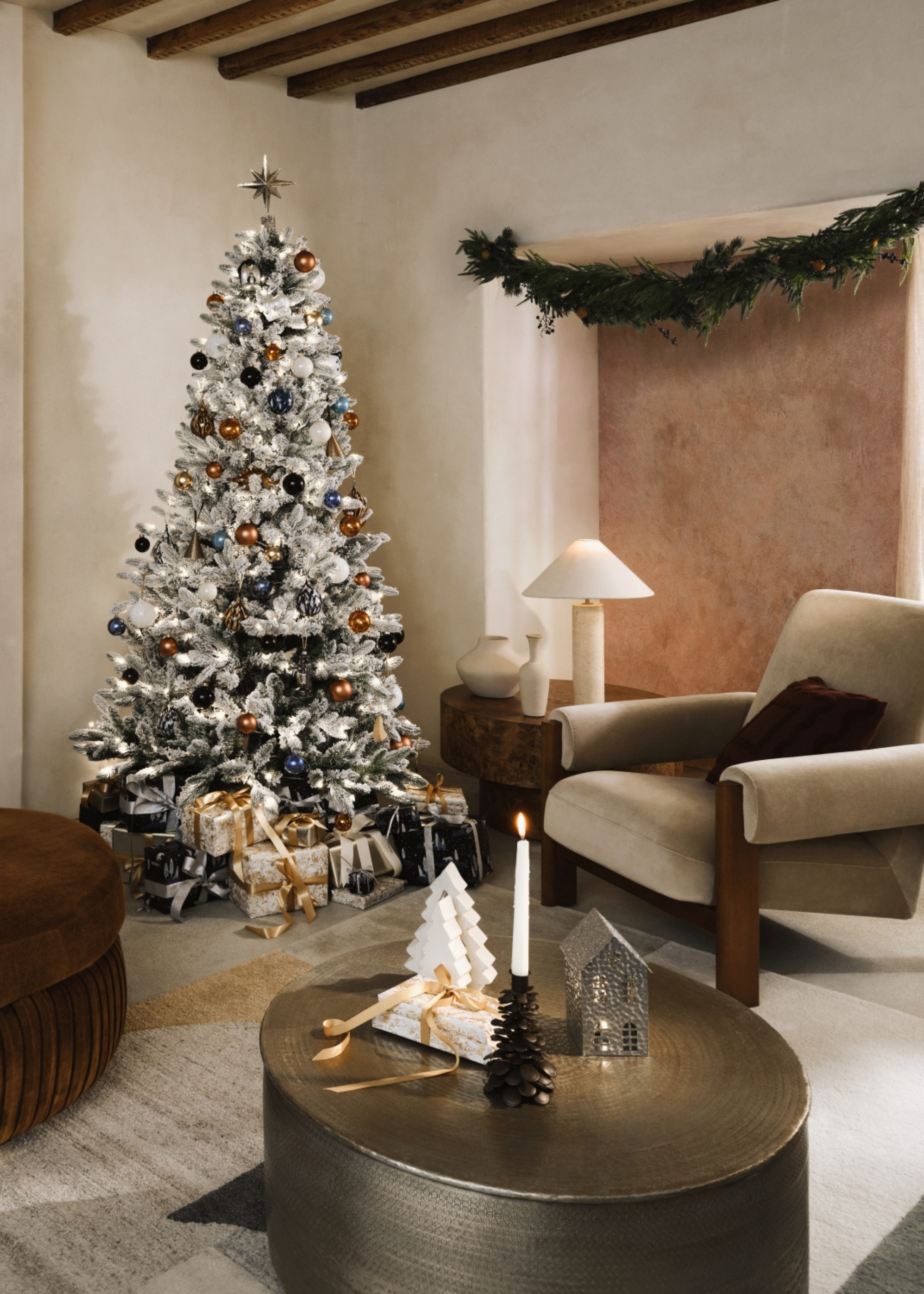 chic simple neutral living room with a white frosted christmas tree in the corner