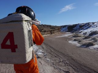 Spacesuit backpacks used at the Mars Desert Research Station essentially consist of a large plastic container with a battery inside, plus a fan for ventilation.