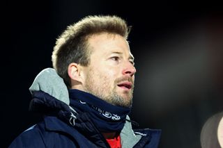 Wade Elliott, manager of Cheltenham, looks on after the Papa John's Trophy quarter final match between Cheltenham Town and Salford City at Completely-Suzuki Stadium on January 10, 2023 in Cheltenham,