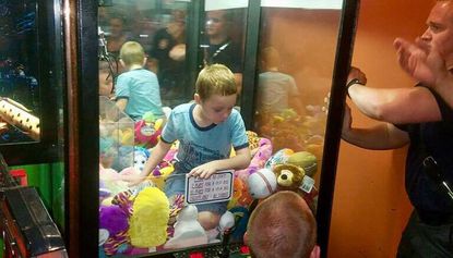 A young boy became trapped in a claw machine in a Florida restaurant