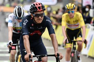 From L Team Ineos Grenadiers Richard Carapaz of Ecuador and Team UAE Emirates Tadej Pogacar of Slovenia wearing the overall leaders yellow jersey ride after crossing the finish line of the 18th stage of the 108th edition of the Tour de France cycling race 129 km between Pau and Luz Ardiden on July 15 2021 Photo by Philippe LOPEZ AFP Photo by PHILIPPE LOPEZAFP via Getty Images