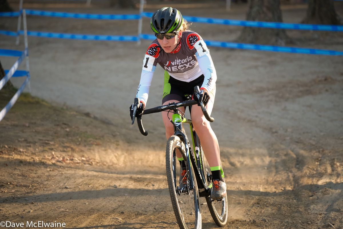 Emma White (Cannondale) riding alone through the woods