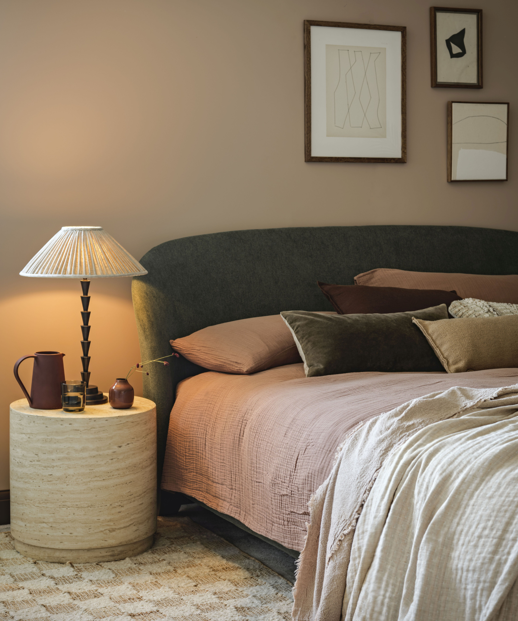Bed with bedside lamp on beside it