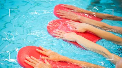 Women swimming with arms outstretched, holding onto swim floats in the water