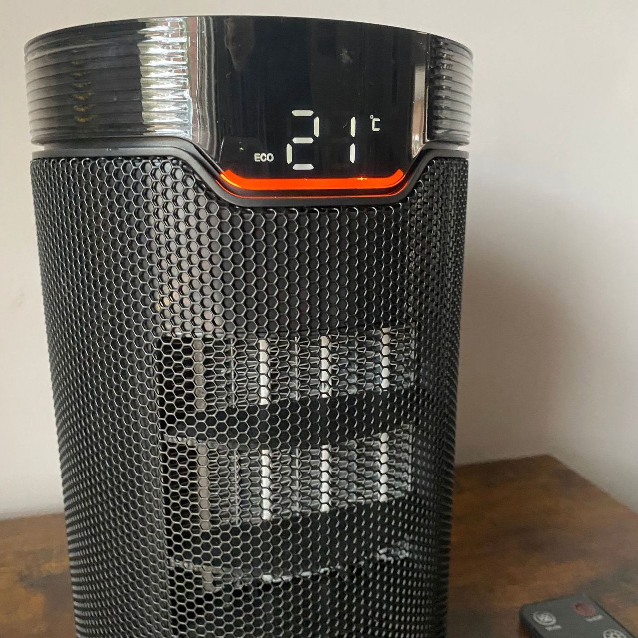 Morphy Richards HeatFlux 1.5kW Ceramic Fan Heater in Eco Mode on a wooden surface