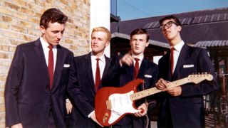 Photo of Tony MEEHAN and Jet HARRIS and SHADOWS and Bruce WELCH and Hank MARVIN; L to R Bruce Welch, Jet Harris, Tony Meehan (holding Fender Stratocaster guitar), Hank Marvin - posed group portrait, c.1960