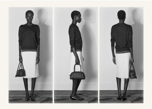 Woman in V-neck sweater and skirt.