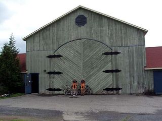 Tory and Jo Wall outside outside our "bike shed" at our accomodation in Bromont. The building was originally used as stables to house horses competing in the Montreal Olympics. Photo: Tim Retchford.