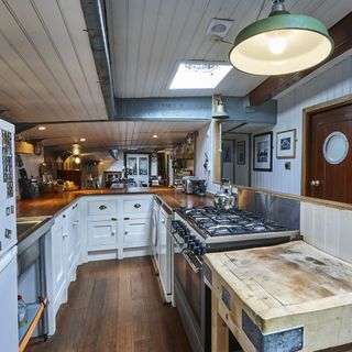 kitchen with wooden flooring and cabinet