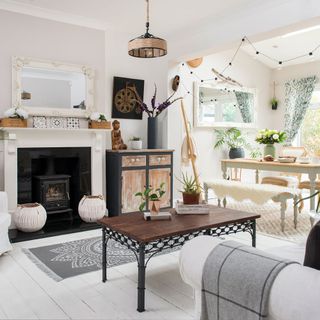 living room with fire stove and wooden table