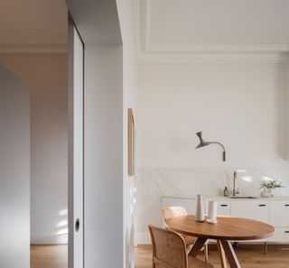 a small apartment with pocket doors between rooms